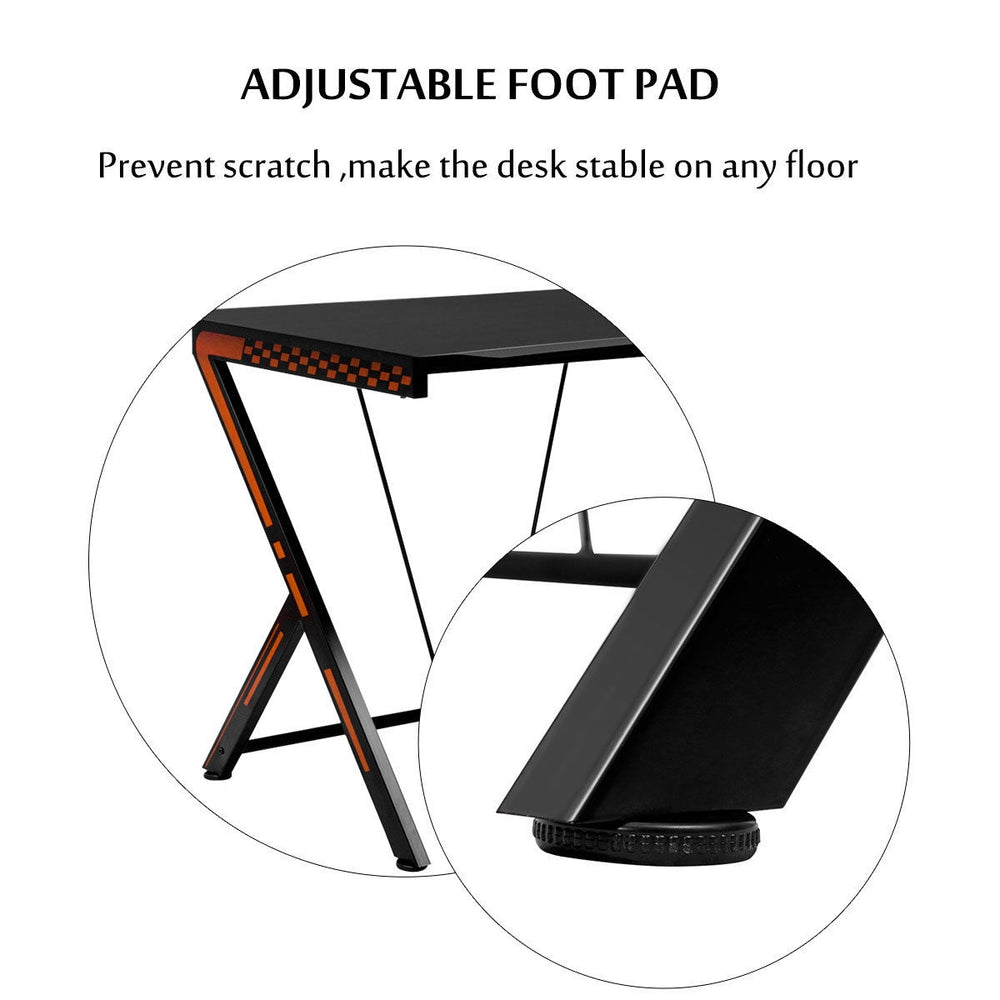 Close-up of the adjustable foot pad on the modern ergonomic computer desk, ensuring stability on any floor surface.