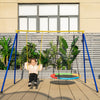 A child swings on a 660 lbs extra-large A-frame swing stand with anti-slip footpads, ideal for outdoor fun.