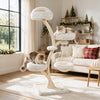 Multi-level beige cat tower with two beds, hammock, and sisal posts, perfect for indoor play and relaxation.