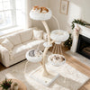 Multi-level beige cat tower featuring two soft beds, a hammock, and sisal posts for climbing and scratching indoors.