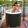 Outdoor ice plunge tub with lid, 66-gallon capacity, featuring thick insulation and inflatable outer ring for comfort.