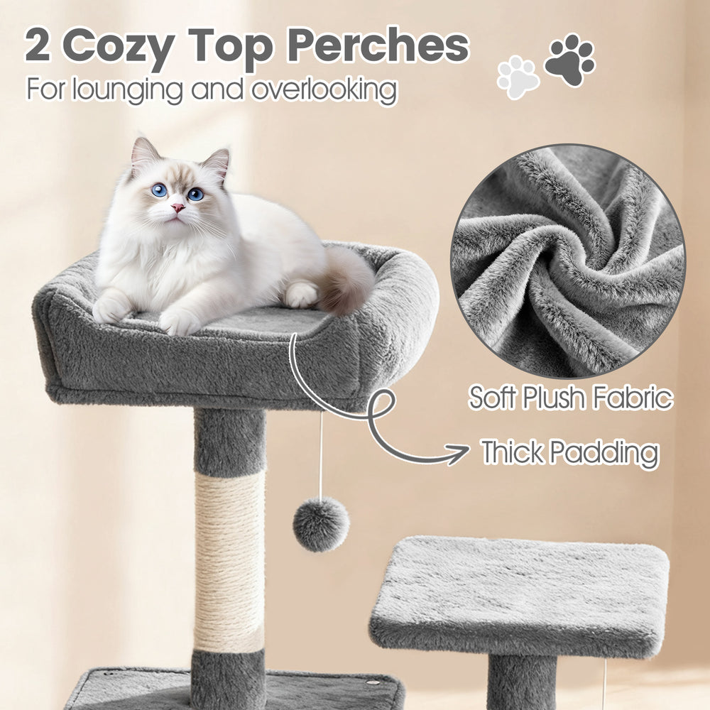 Cozy top perch of a 66-inch tall cat tree in light gray, featuring soft plush fabric and thick padding for lounging.