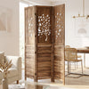 Folding room divider with tree cutout and louver design in rustic brown, ideal for separating living and dining areas.