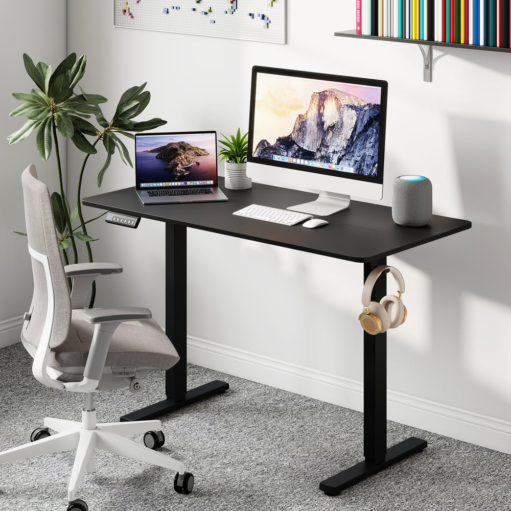 Ergonomic electric standing desk in black, 48" x 24", with adjustable height and 3 memory settings for home office use.