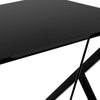 Close-up of the black MDF surface of a modern ergonomic computer desk, designed for small spaces and durability.