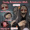 Life-sized Halloween animatronics witch with crimson glowing eyes, movable head and arms, and a flashing magic ball.
