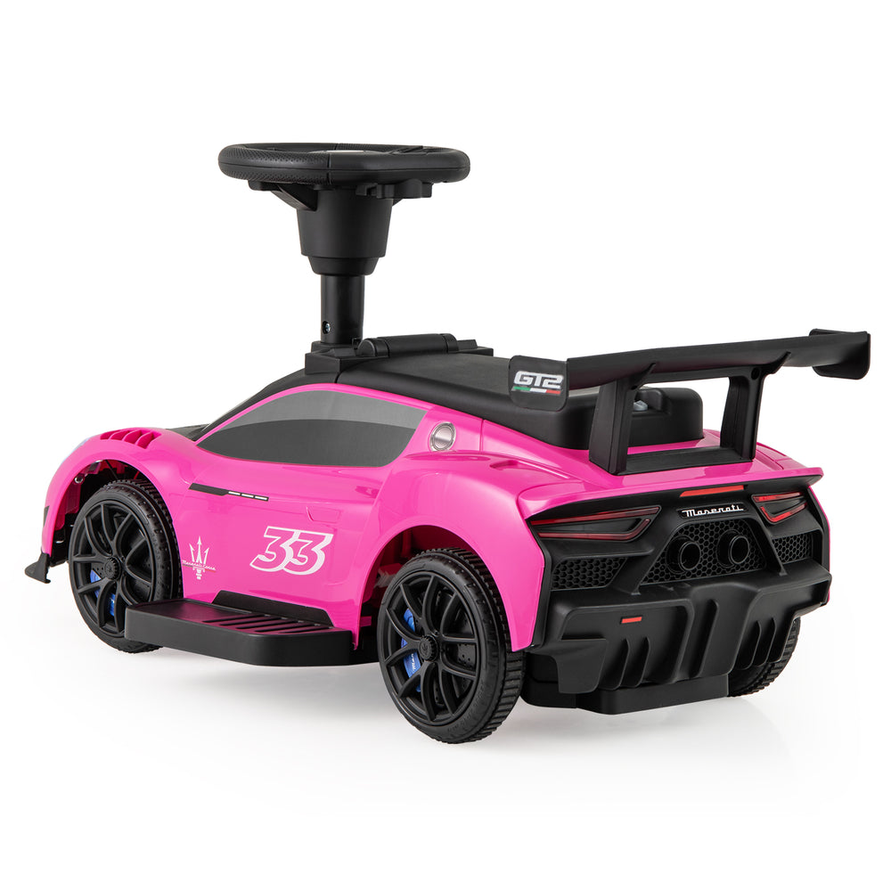 Pink Maserati licensed 6V electric kids ride-on car with steering wheel, foot pedal, and LED lights for fun driving.