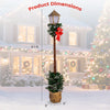 6.1 feet Christmas pre-lit street lamp with artificial greenery, snow-flocked tips, and festive red bow for outdoor decoration.