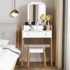 Vanity table set with large mirror, white finish, and cushioned stool for comfortable makeup application and storage.