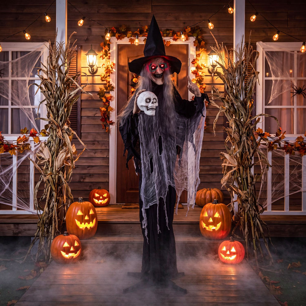 Halloween standing animatronic witch with flickering eyes and skull, perfect for trick-or-treat displays on porches.