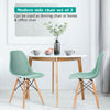 Modern plastic hollow chair set of 2 in green with wood legs, perfect for dining or office use.