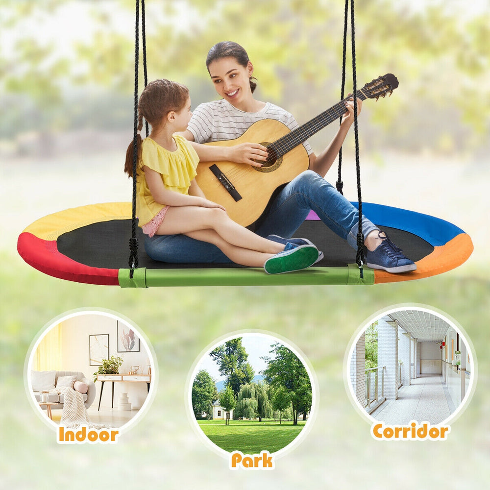Colorful 60-inch saucer swing for indoor and outdoor use, adjustable height, supports up to 700lbs for multiple kids.