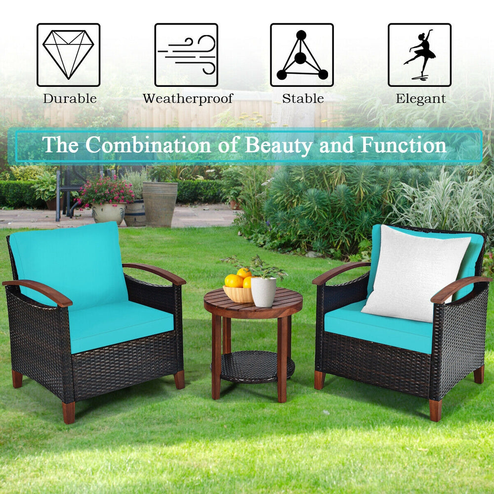 Turquoise 3-piece patio rattan furniture set with acacia wood table, featuring thick cushions for outdoor relaxation.