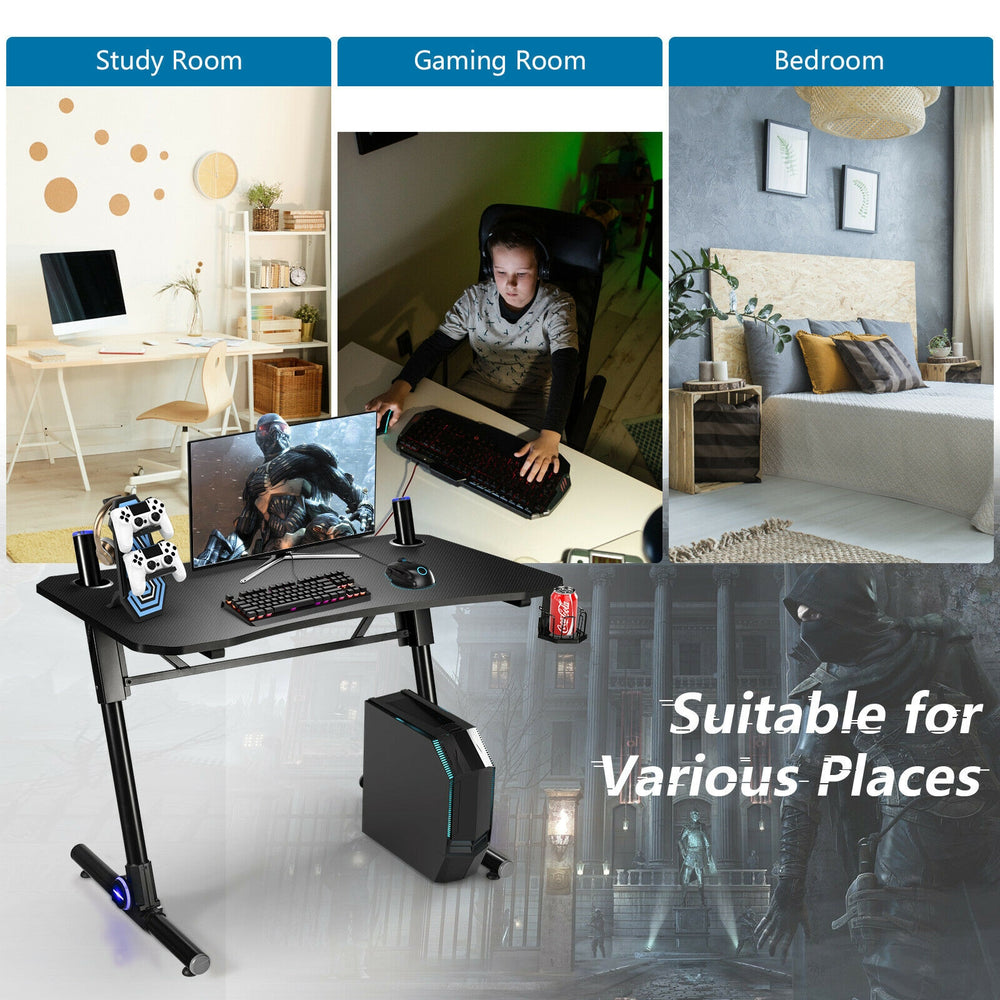 Gaming desk with ergonomic design, LED lights, and sturdy Z-shaped legs, ideal for gaming or as a multifunctional.