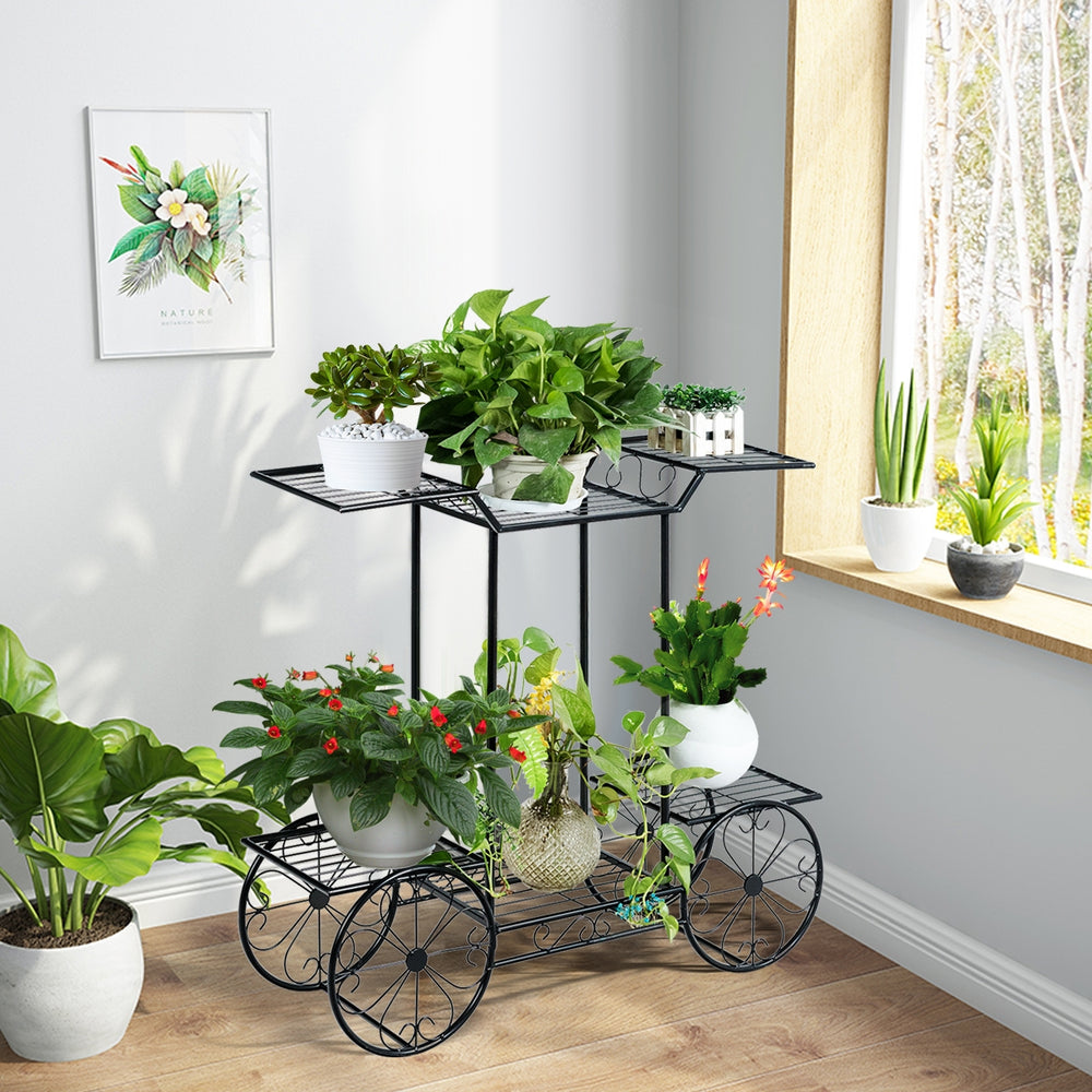 6-tier garden cart flower rack in black, showcasing plants indoors with a unique design for decorative display.
