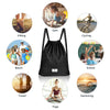 Drawstring backpack in black with zipper pockets, ideal for gym, yoga, travel, and outdoor activities.