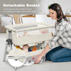 Portable baby bedside sleeper with adjustable height and angle, featuring a detachable basket for convenient care.