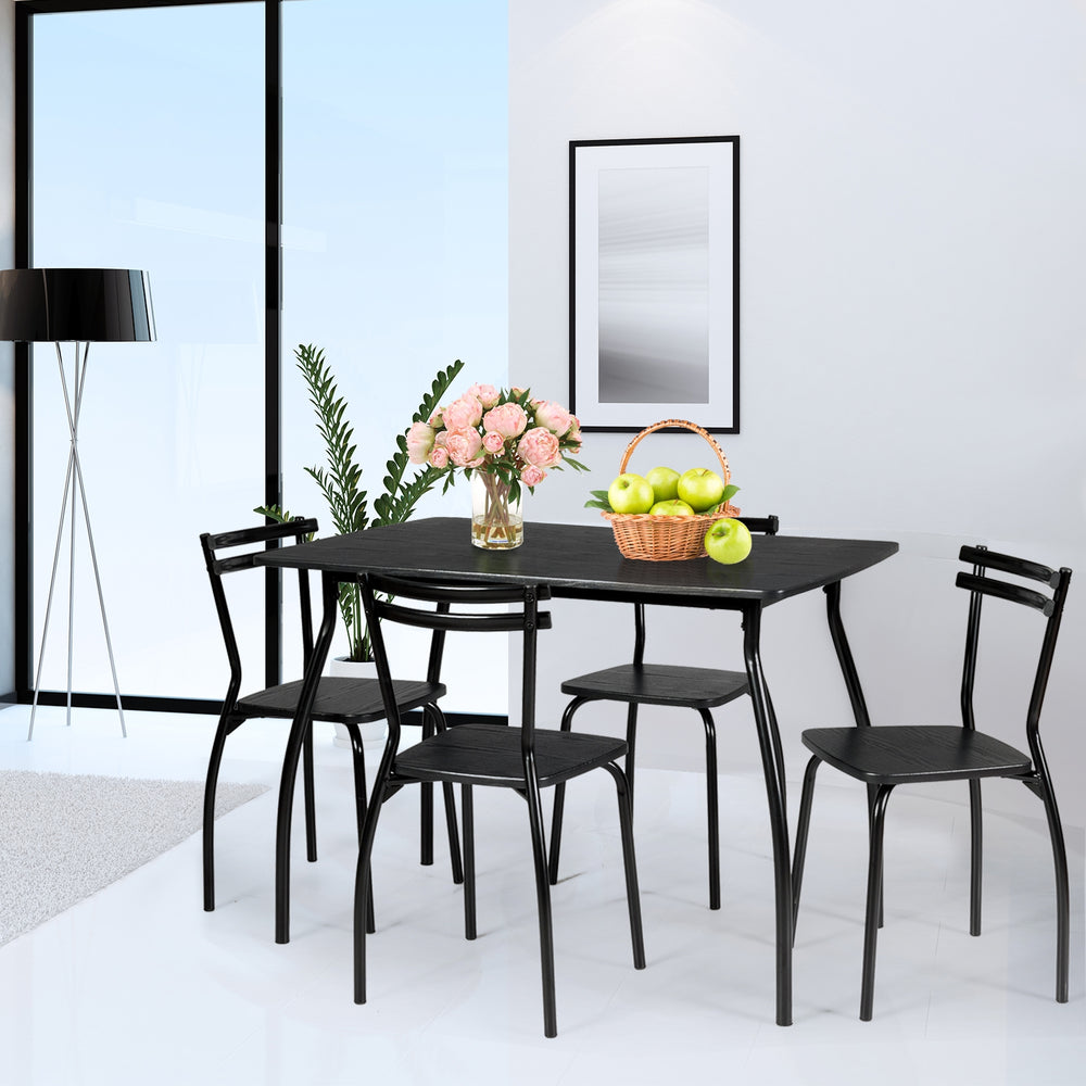 5-piece dining table set with 4 chairs, featuring a sturdy steel frame and minimalist design, perfect for kitchens.