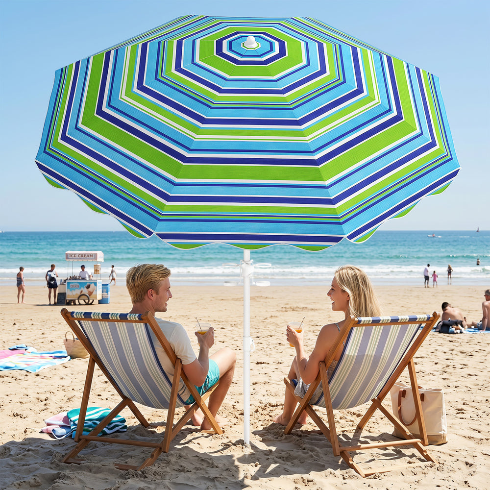 Beach umbrella with green stripes, UPF 50+, features a sand anchor and tilt function for optimal sun protection.