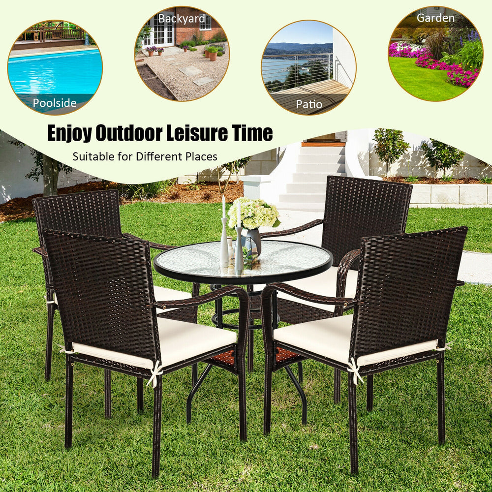 Set of 4 stackable patio rattan dining chairs with cushioned armrests, perfect for outdoor use in garden or poolside.