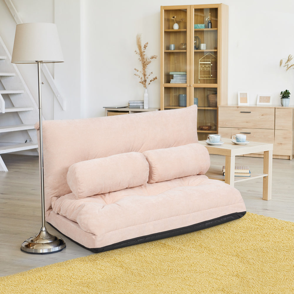 Beige 6-position adjustable sleeper lounge couch with two pillows, perfect for versatile seating and sleeping options.