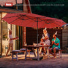 Double-sided 15-foot dark red patio umbrella with 48 solar LED lights, perfect for outdoor gatherings and shade.