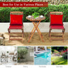 Folding bistro set with red padded cushions and round coffee table, made of solid acacia wood for outdoor use.