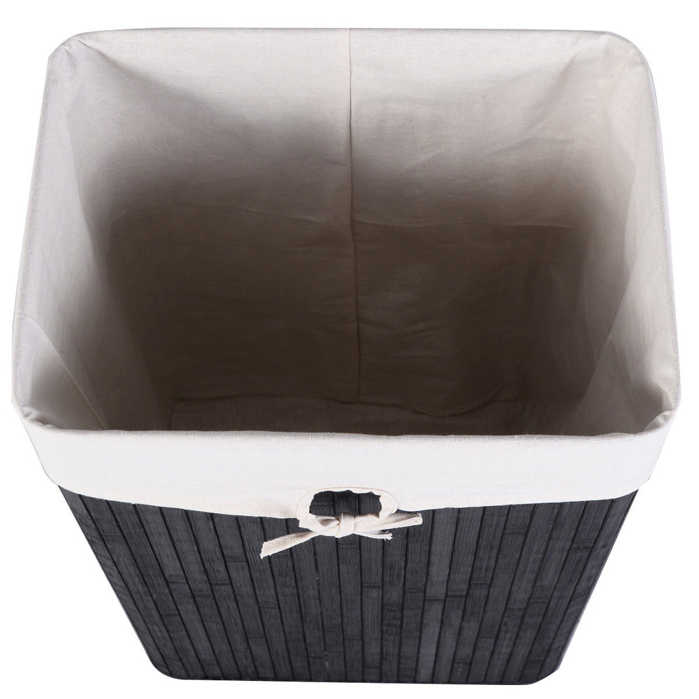 Rectangular black bamboo laundry hamper with a removable cotton inner pocket and sturdy lid for easy transport.