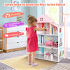 3-tier toddler dollhouse showcasing a child playing with furniture, enhancing social skills and imaginative thinking.