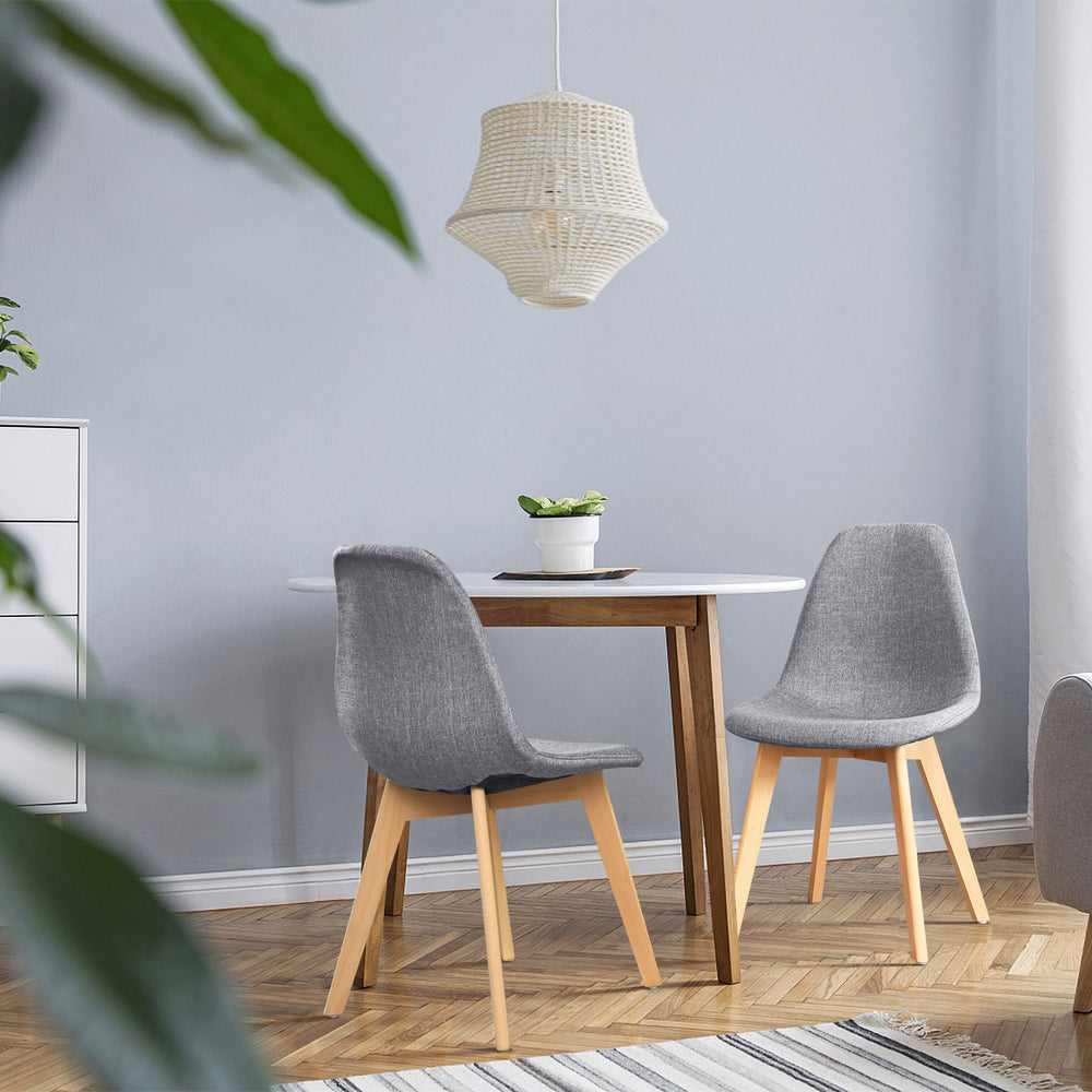 Modern dining chair set with wood legs and fabric cushion seats, perfect for dining rooms or lounges.