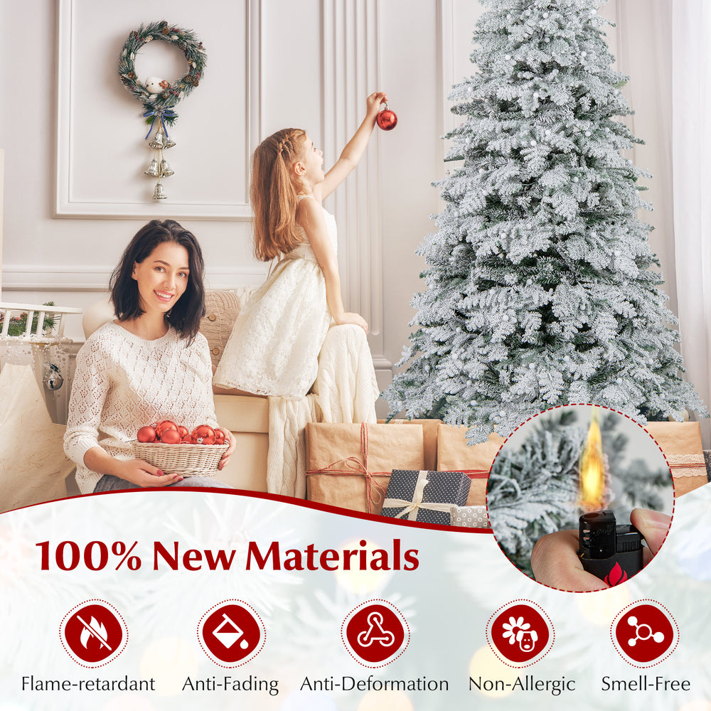 6-foot pre-lit artificial snow-flocked Christmas tree with 130 twinkle balls, featuring warm white LED lights for.