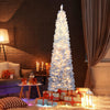 Slim 6-foot snow-flocked artificial Christmas tree with warm white LED lights, creating a magical winter ambiance for.