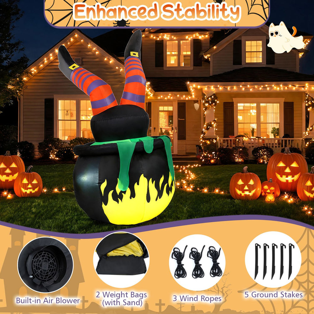 Close-up view of the animated Halloween inflatable kicking witch's pointed boots and striped stockings, adding festive charm.