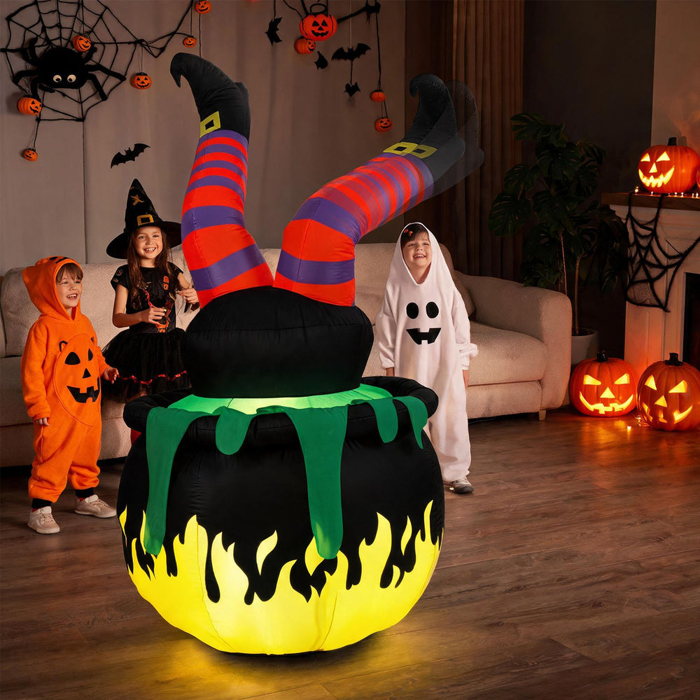 Animated 6 FT Halloween inflatable kicking witch with LED light and flaming cauldron design for festive outdoor decoration.