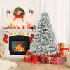 Snowy 6 ft artificial Christmas tree with warm white LED lights, surrounded by festive decorations and gifts.