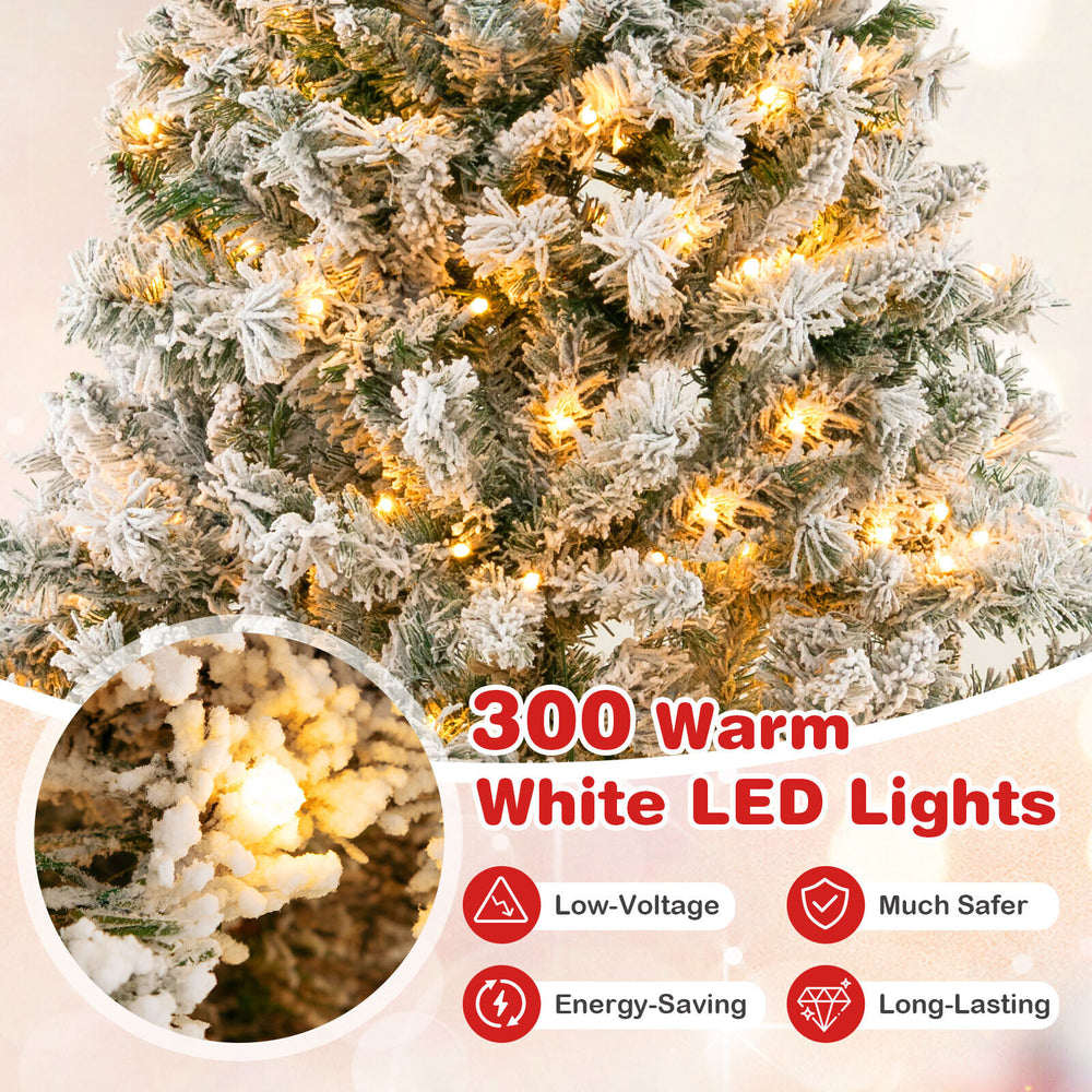 Close-up of the 6 ft artificial Xmas tree with 300 warm white LED lights, featuring white flocking for a wintry look.