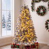 Pre-lit 6 FT Christmas tree with feather-inspired branch tips and warm white LED lights for a stylish holiday display.
