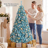 Pre-lit 6 FT peacock blue Christmas tree with warm white LED lights, perfect for festive holiday displays.