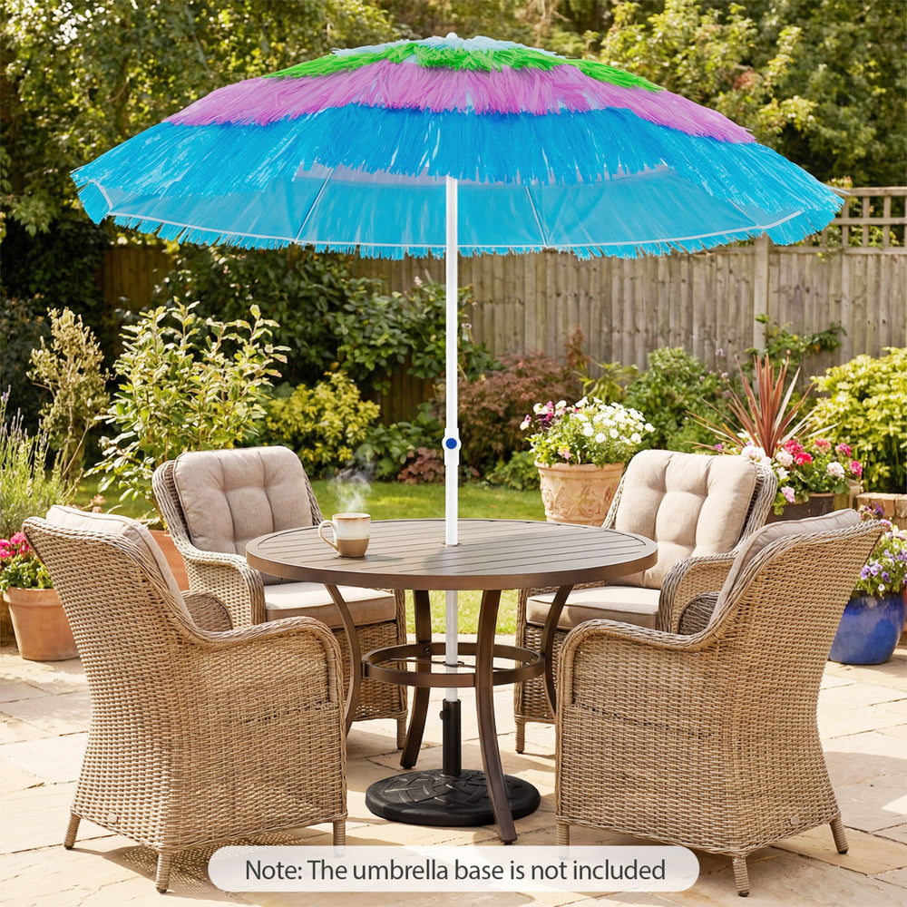 Colorful 6 FT tiki thatched patio umbrella with push button tilt, ideal for beach or garden use, shown above a dining.