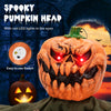 Spooky pumpkin head with red LED eyes and poseable arms, perfect for creating an eerie atmosphere indoors or outdoors.