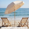 6 feet white patio umbrella with fringe and wood pole, featuring push button tilt, perfect for beachside relaxation.