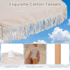 Close-up of the exquisite cotton tassels and sturdy beech pole on a 6 feet white patio umbrella for coastal charm.