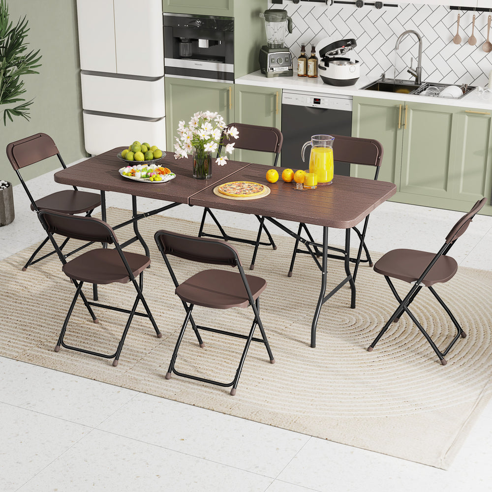 Folding table with wood grain HDPE tabletop and metal legs, ideal for indoor or outdoor gatherings, featuring a 6 x 2.5.