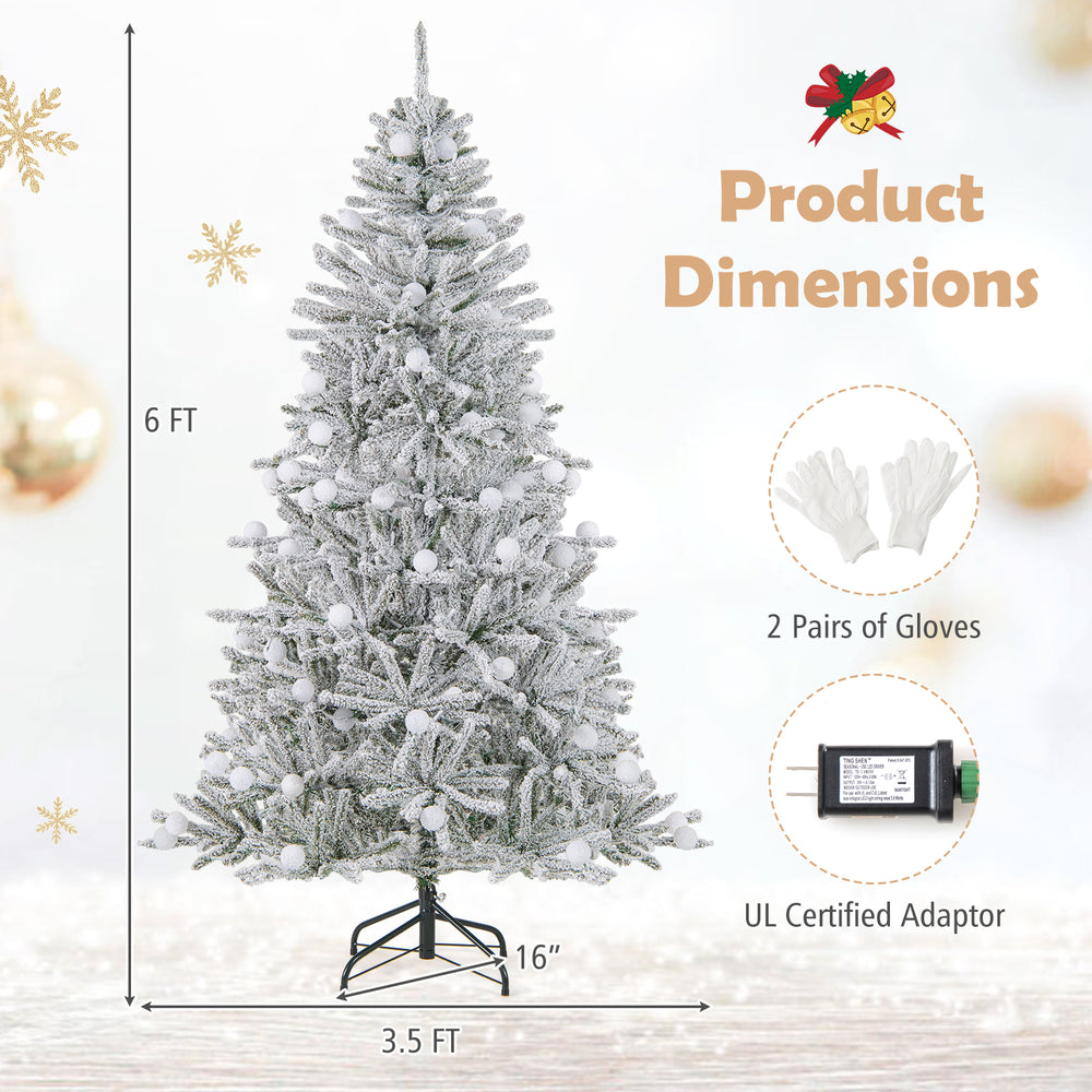 Snow-flocked 6-foot artificial Christmas tree with 81 sphere lights, featuring hinged branches and remote control for.