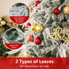 Snow-flocked branches of a 6-foot artificial Christmas tree showcasing realistic PE and vibrant PVC leaves for festive.