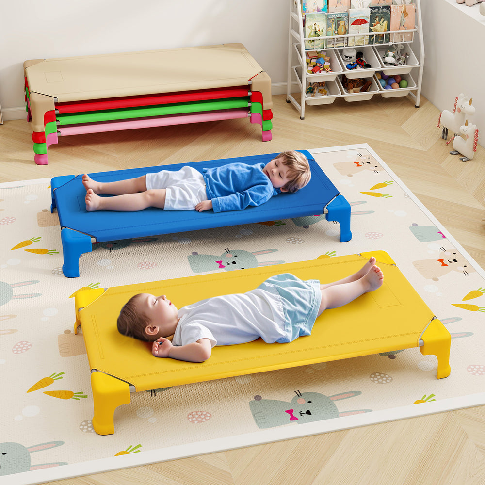Two kids resting on multicolor portable daycare cots, featuring sturdy design and non-slip foot pads for safety.