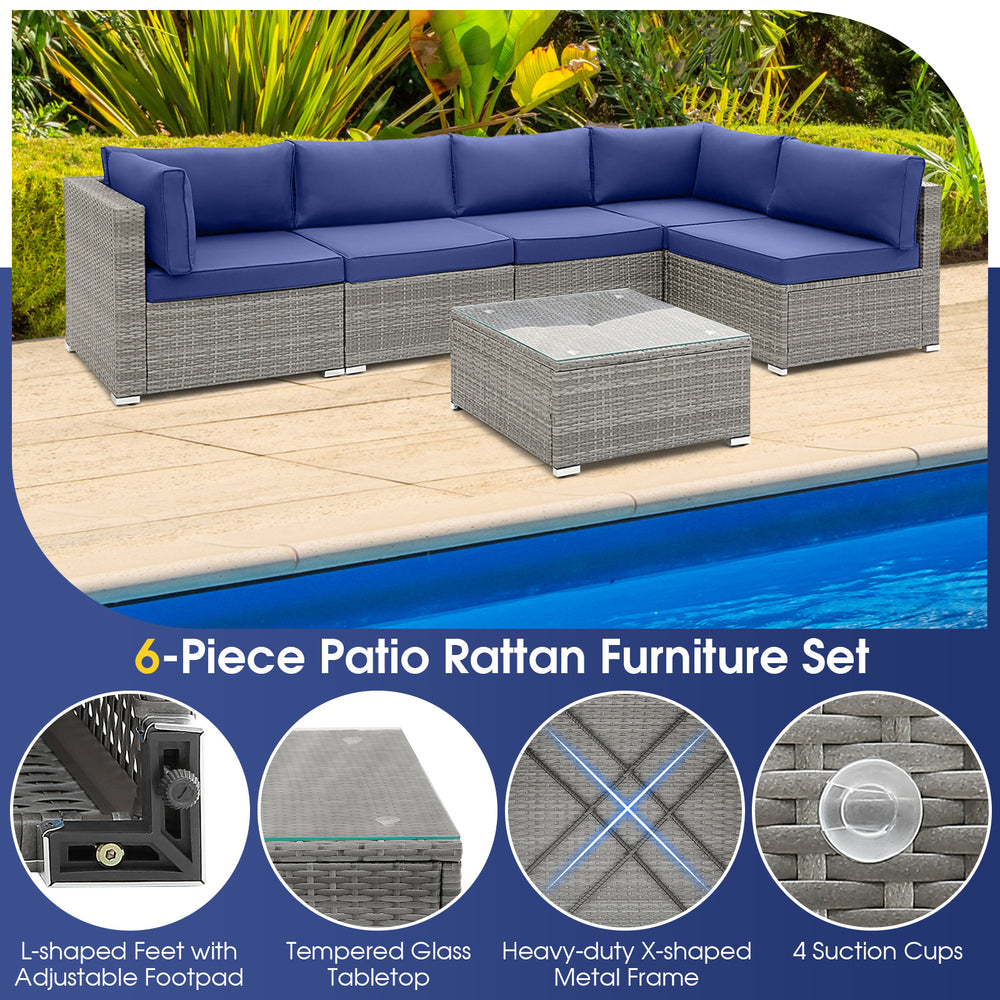 L-shaped 6-piece patio rattan furniture set with navy cushions and tempered glass coffee table for outdoor relaxation.