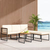 6-piece acacia wood patio furniture set with beige cushions, featuring a coffee table and ottomans for outdoor.