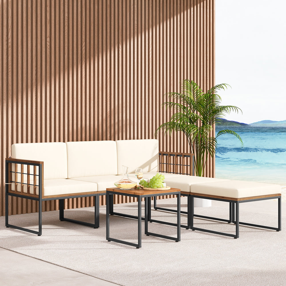 6-piece acacia wood patio furniture set with beige cushions, featuring a coffee table and ottomans for outdoor.