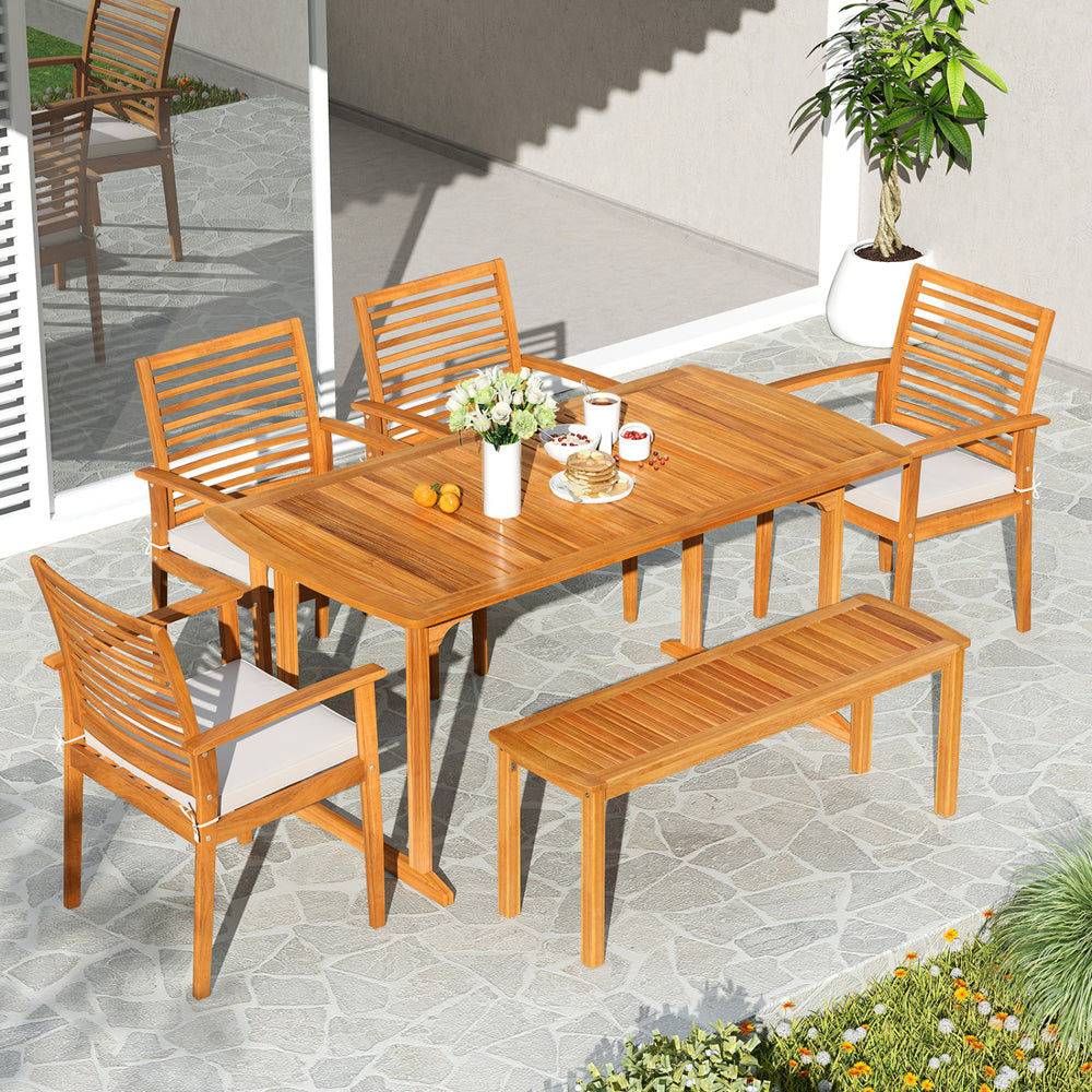Outdoor acacia wood dining set with six chairs and a spacious tabletop, perfect for backyard gatherings.
